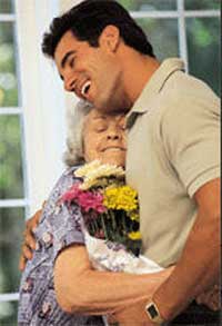 Young Man Hugs Grandmother